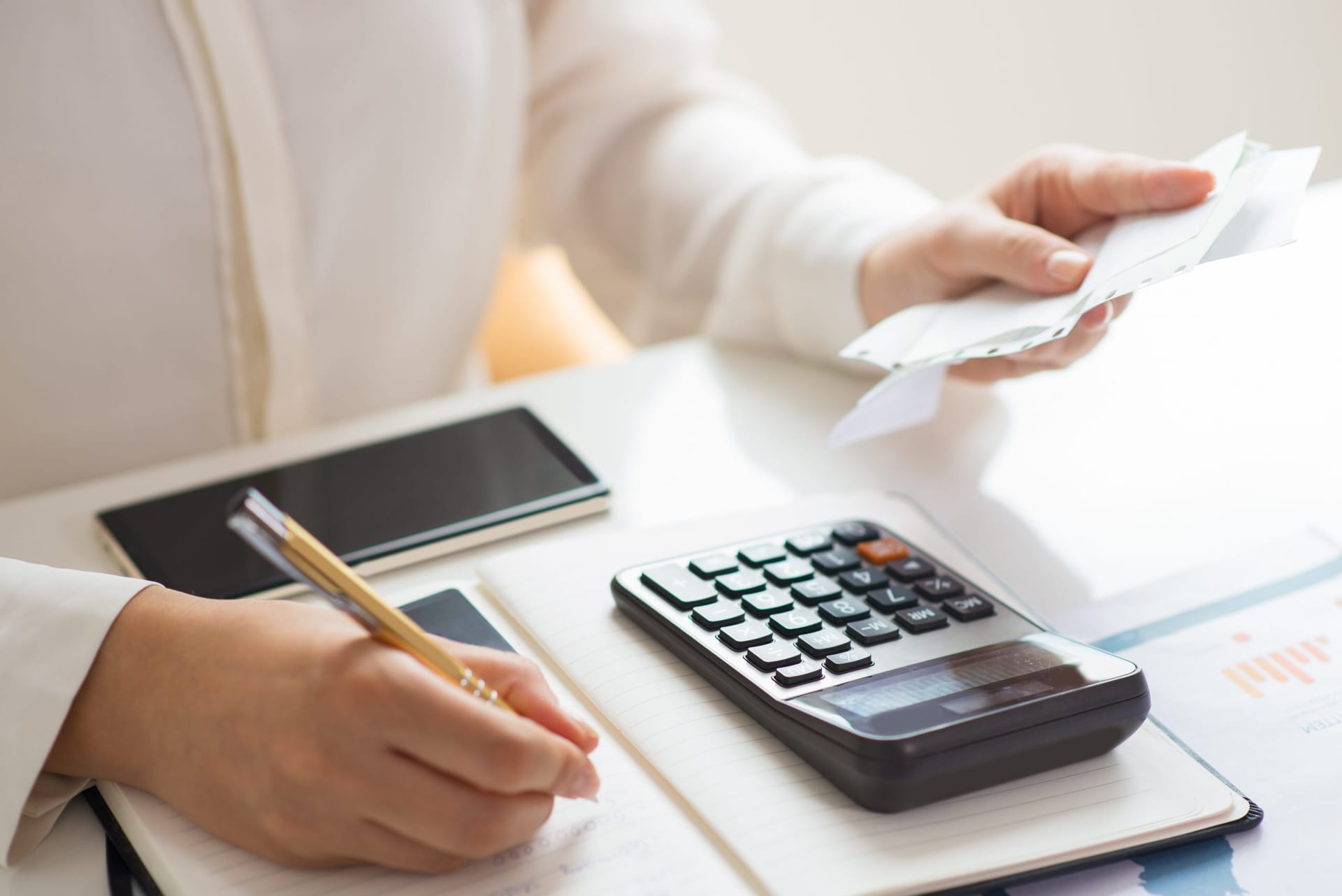 Financial ledger book and calculator for Singapore accounting and bookkeeping